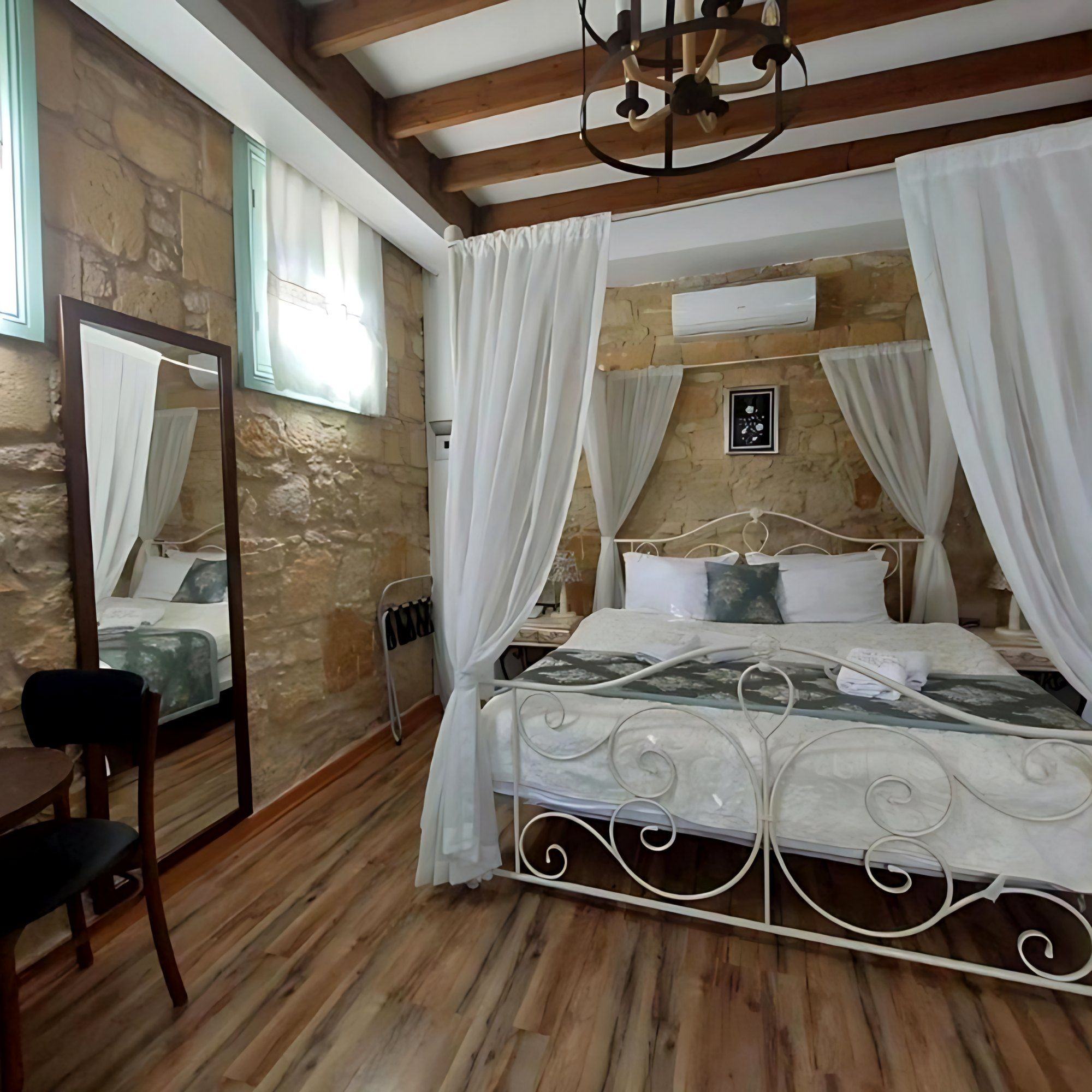 Canopy bed in a stone-walled room