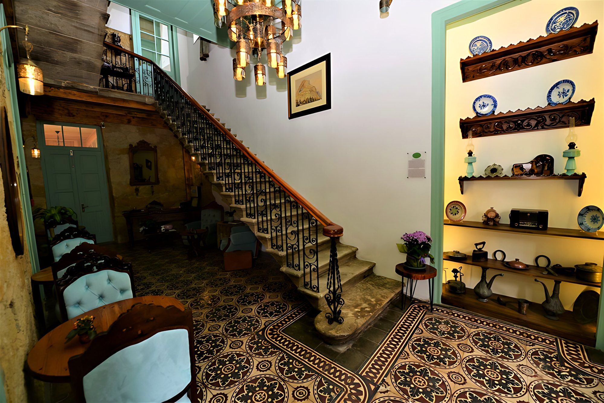 The entrance hall with its staircase and tiled floor